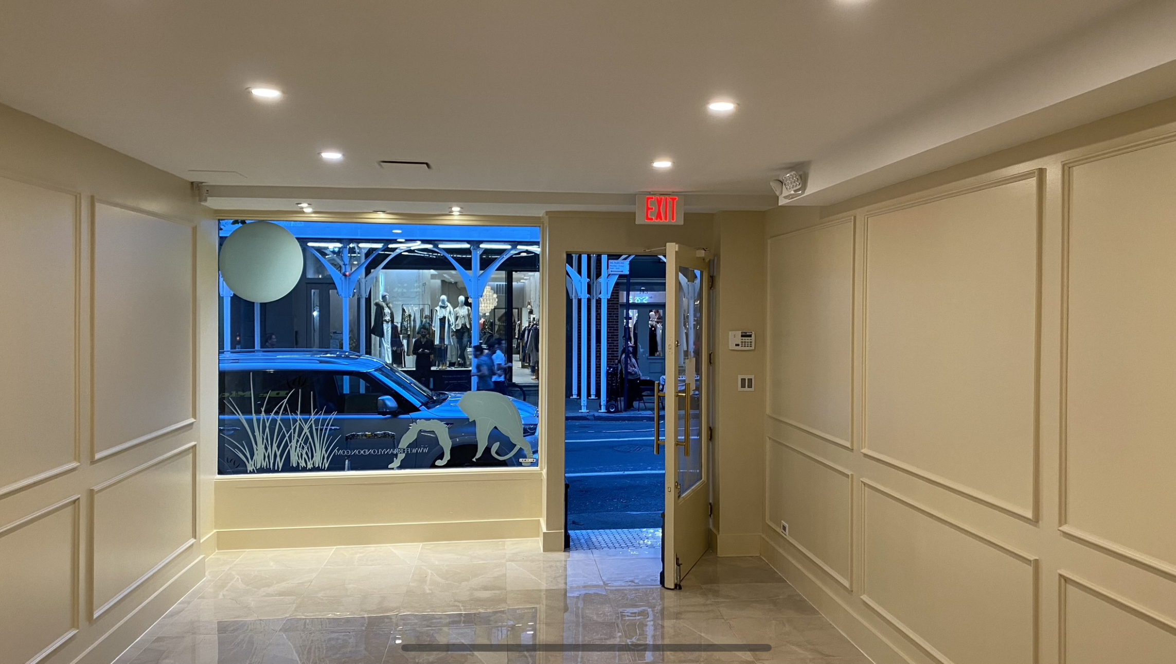 Finished SOHO storefront interior with painted walls, trim and decorative molding
